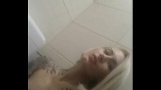 Sexy blonde masturbate in a public shop  toilet